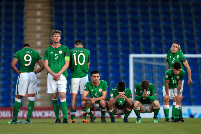 The Ireland team dejected after losing the game on penalties