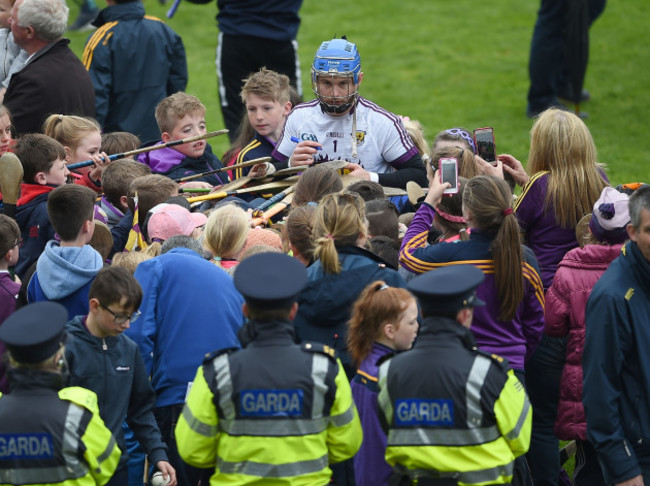 Mark Fanning signs autographs for supporters after the game