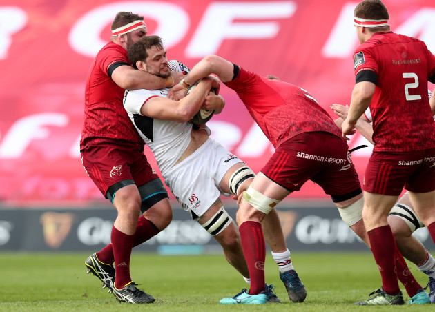 Clive Ross is tackled high by James Cronin