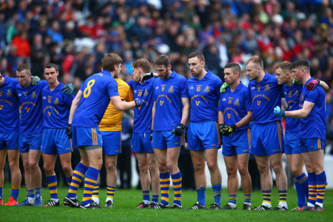 Ian Maguire speaks to his teammates before the game