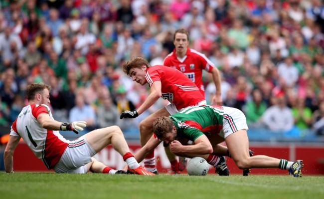 Robert Hennelly and Aidan O’Shea block Ian Maguire