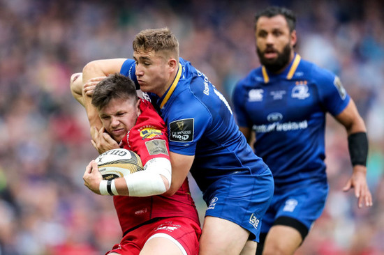 Jordan Larmour tackles Steff Evans