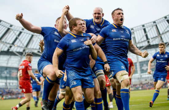 Sean Cronin celebrates scoring his sides third try  with Tadhg Furlong, Devin Toner and Jack Conan