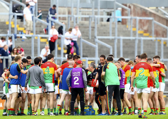 Turlough O'Brien, gathers his team on the pitch at half time