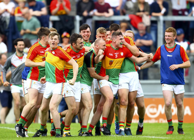 Carlow players celebrate at the final whistle