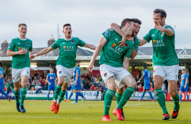 Garry Buckley celebrates scoring his sides opening goal with Barry McNamee and Alan Bennett