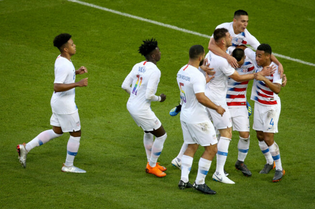 Bobby Wood celebrates his goal with teammates