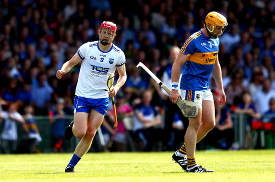 DJ Foran celebrates scoring as Padraic Maher looks dejected