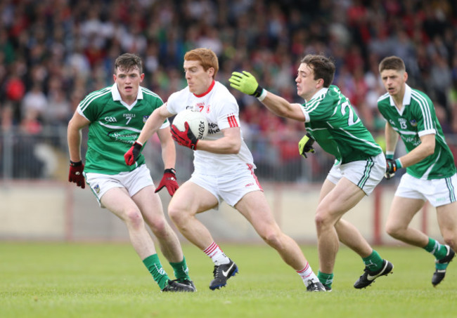 Peter Harte gets away from Stephen Cahill and Cian Sheehan