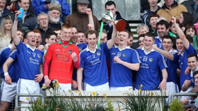 Seanie Buckley lifts the Division 4 trophy with teammates