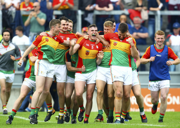 Carlow players celebrate at the final whistle