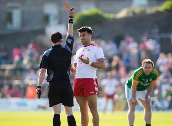 Tiernan McCann is shown a red card