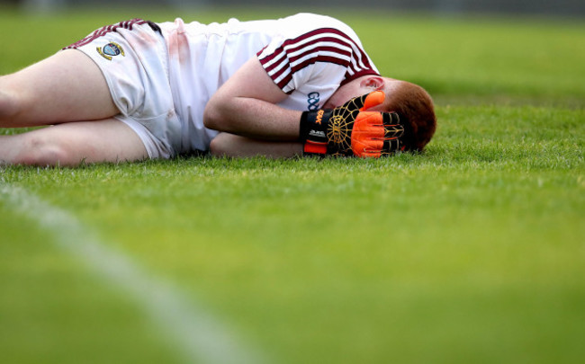 Kevin Fagan dejected after spilling the ball into his own goal