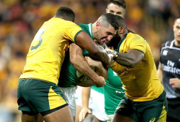 Samu Kerevi and Marika Koroibete tackle Rob Kearney