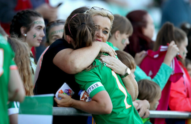 Katie McCabe is consoled after the game