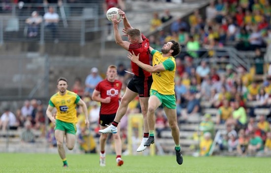 Odhran Mac Niallais with Caolan Mooney