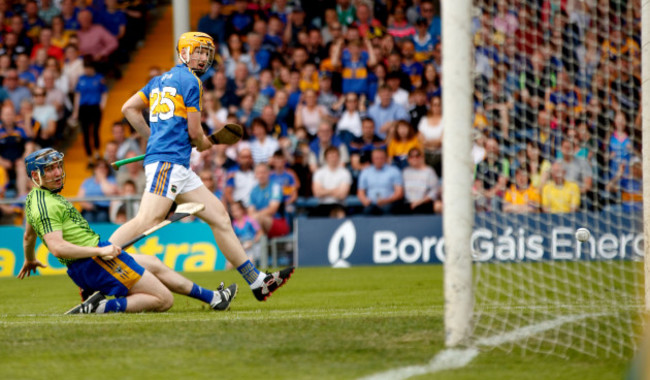 Jake Morris shots past goalkeeper Donal Tuohy only for his shot to hit the post