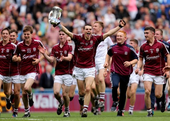 Sean Loftus celebrates winning with the trophy