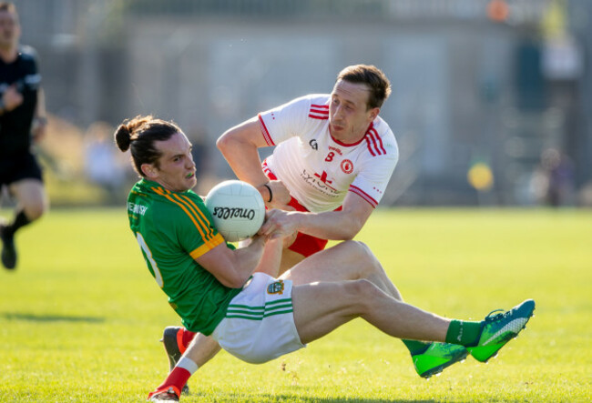 Cillian O'Sullivan is brought down by Colm Cavanagh