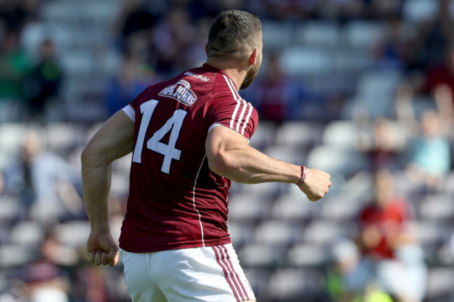 Damien Comer celebrates scoring a goal