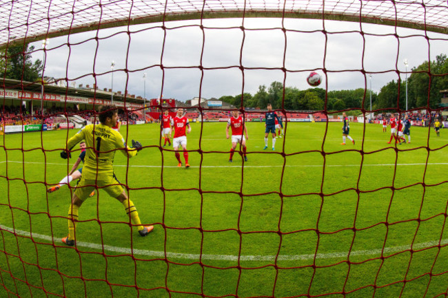 Barry Murphy is unable to stop Rhys McCabe scoring a goal