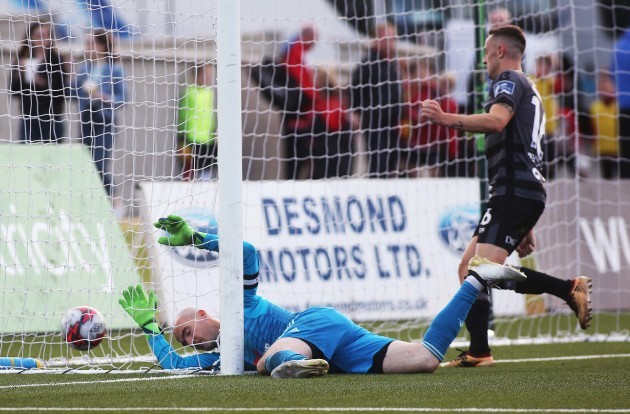 Gerard Doherty spills to concede the opening goal by Robbie Benson