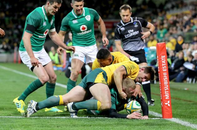 Keith Earls knocks on whilst attempting to ground the ball under pressure from Bernard Foley