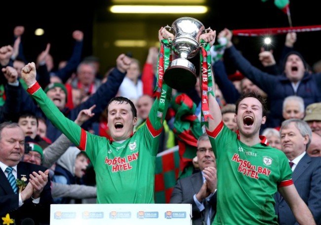 Gearóid Cunniffe and Darragh Donnelly lift the trophy