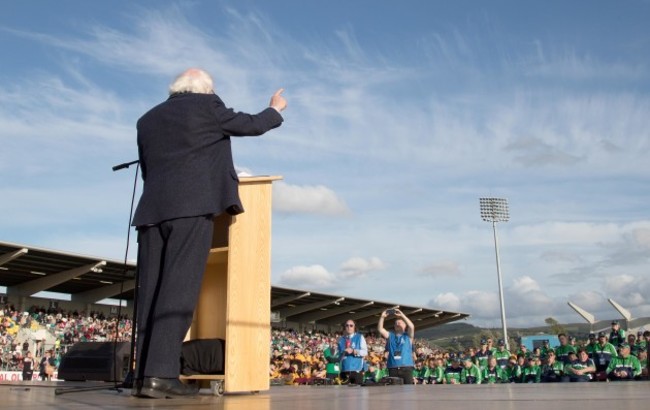 Michael D. Higgins speaks on stage to the athletes