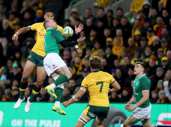 Keith Earls wins a high ball ahead of Israel Folau