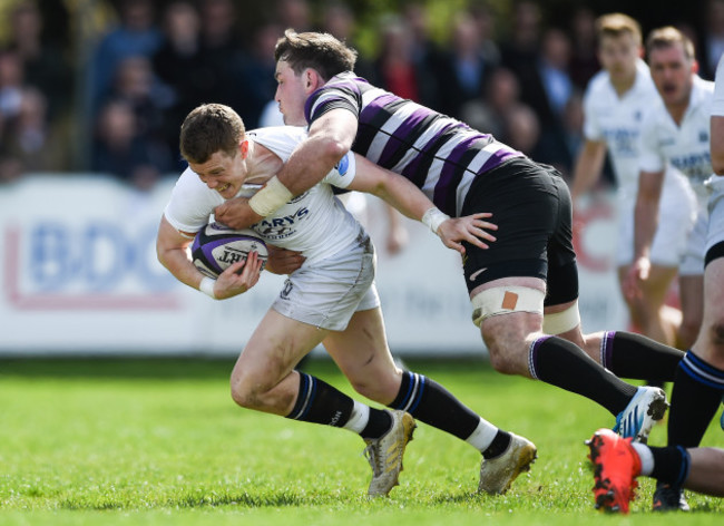 Gerry Hurley is tackled by Alex Thompson