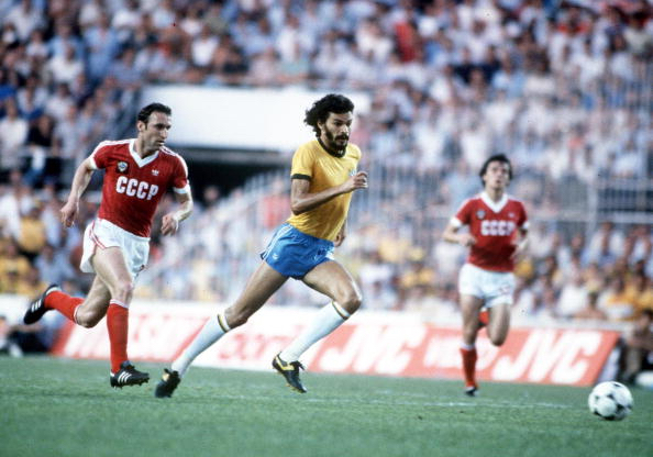 1982 World Cup Finals. Seville, Spain. 14th June, 1982. Brazil 2 v USSR 1. Brazil's Socrates out-runs USSR's Tengiz Sulakvelidze for the ball.
