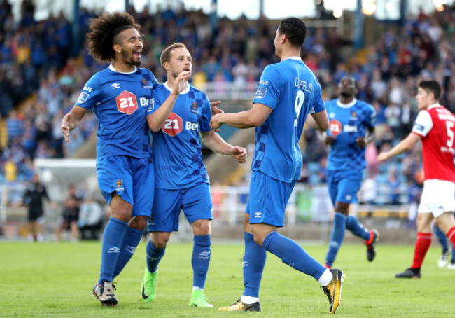 Courtney Duffus celebrates scoring a goal with Bastien Hery and Sander Puri