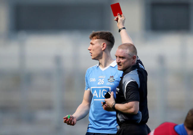 Barry Cassidy shows John Small a red card