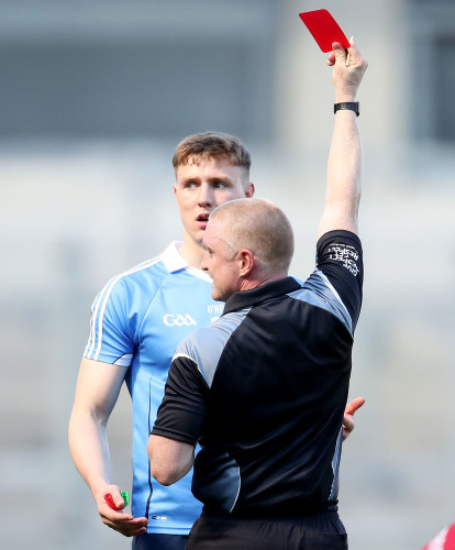 Barry Cassidy shows John Small a red card