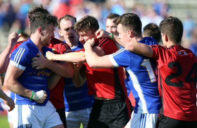 Down and Cavan players tussle after the game