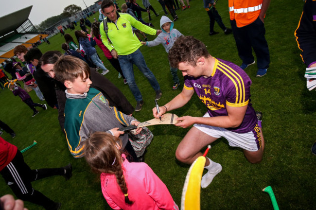 Rory O'Connor signs autographs after the game