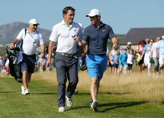 Rory McIlroy on the fairway with Tony McCoy