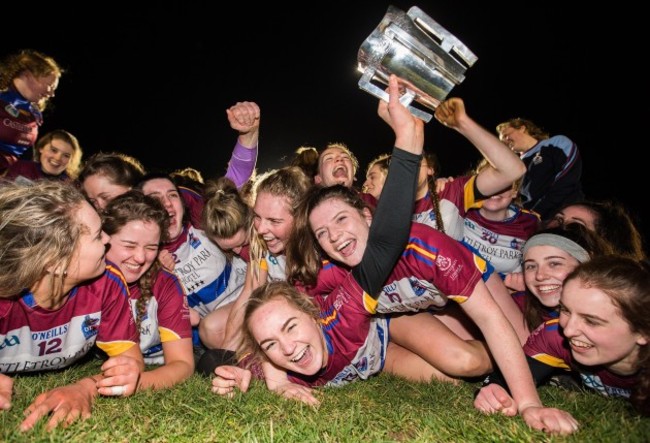 Sarah Fryday celebrates after the game with the trophy