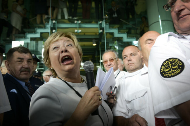 Poland: Chief Justice Defies Retirement Law