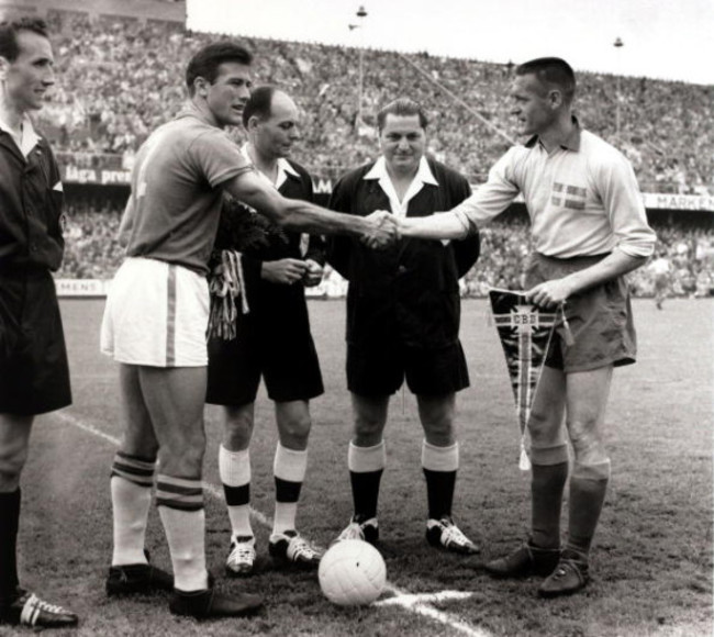 Sport/Football. 1958 World Cup Final. Stockholm. 29th June 1958. Sweden 2 v Brazil 5. The Brazil captain Bellini (left) greeted by Sweden captain Nils Liedholm before the final as the match officials look on.