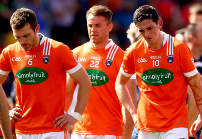 Brendan Donaghy, Kevin Dyas and Rory Grugan dejected after the game