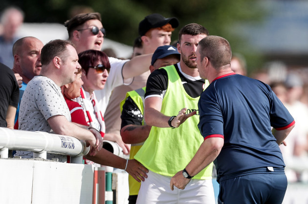 Rodney Dalzell in altercation with Sligo Rovers supporters held back by Patrick McClean