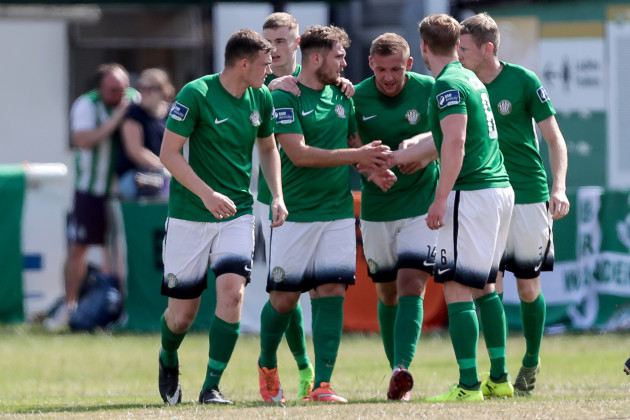 Gerald Pender celebrates with teammates after scoring a goal