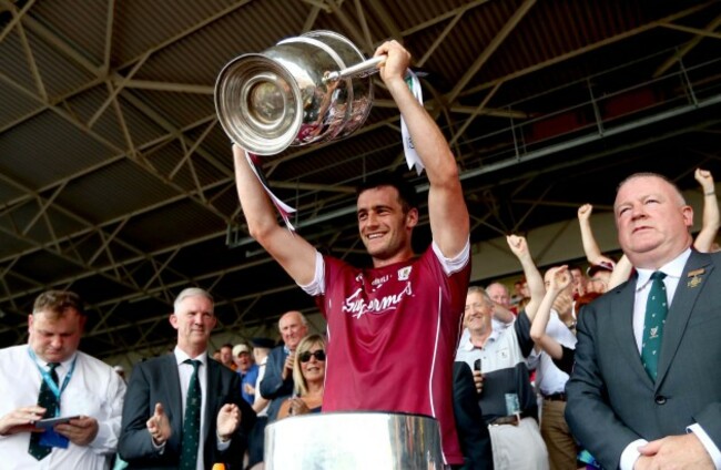 David Burke lifts the Bob O'Keeffe Cup