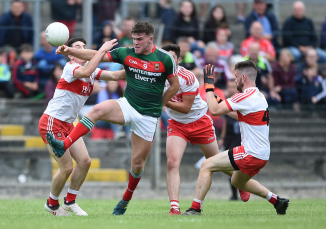 Jordan Flynn with Conleth McShane, Mark McGrogan and Eoghan Concannon