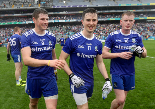 Darren Hughes, Shane Carey and Ryan McAnespie celebrate after the game