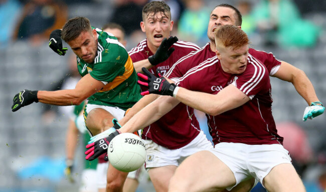 Micheal Burns blocked by Johnny Heaney, Cathal Sweeney and Sean Andy O Ceallaigh