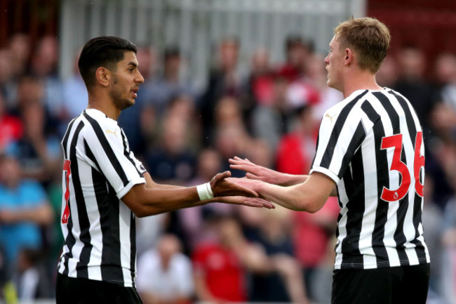 Ayoze Perez celebrates with Sean Longstaff after he scored a goal