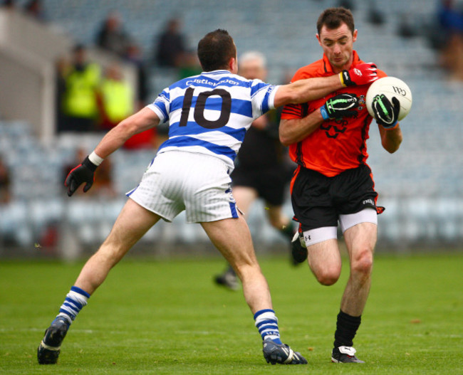 Donncha O'Connor is tackled by Roland Whelton
